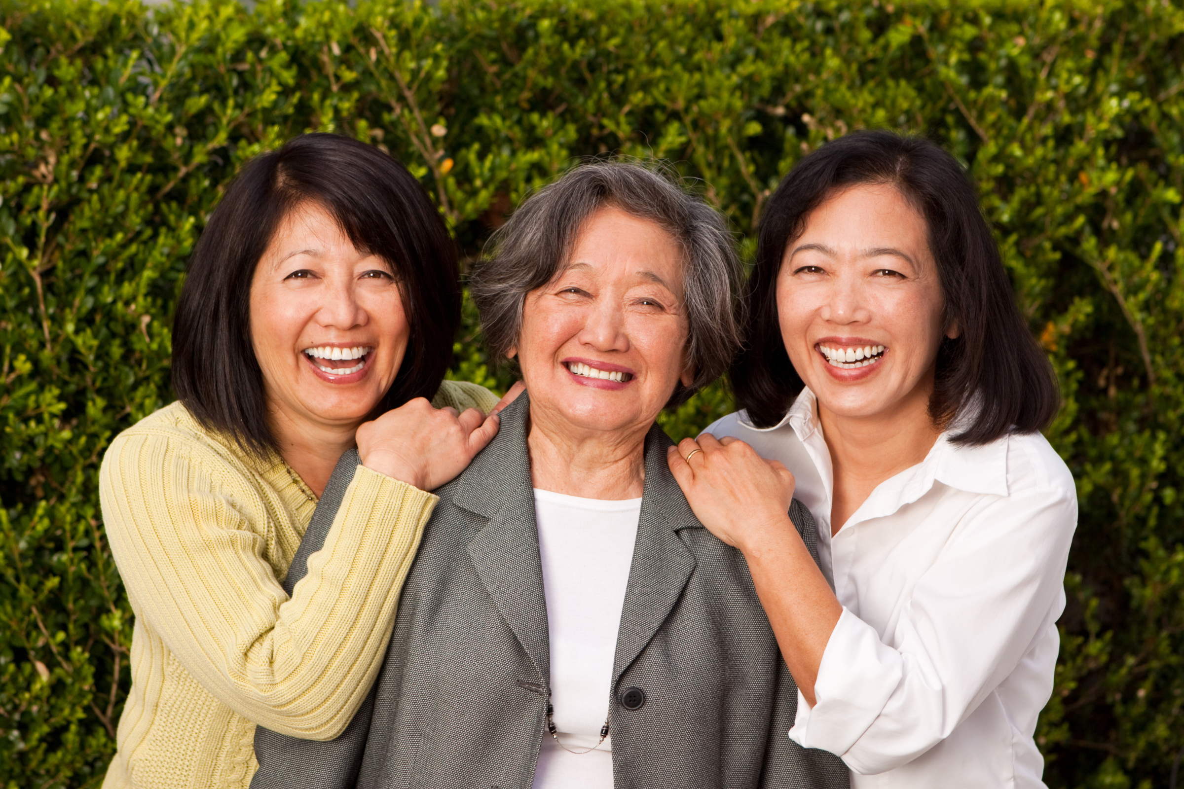Older woman with her two adult daughters