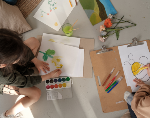 two kids coloring and painting