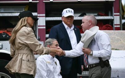 Melania and Donald Trump meeting with the governor of Texas and a local