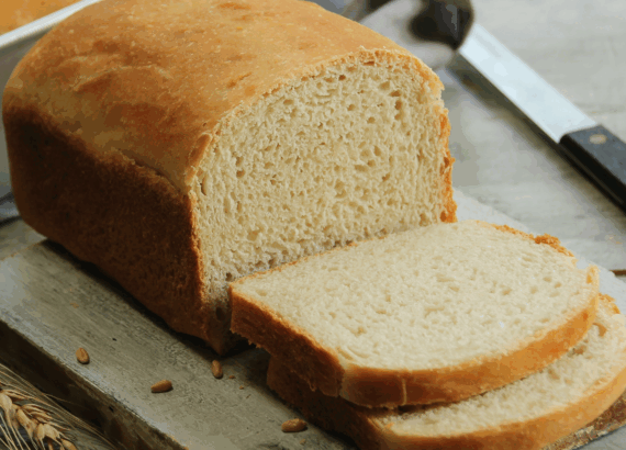 loaf of sandwich bread sliced on a table
