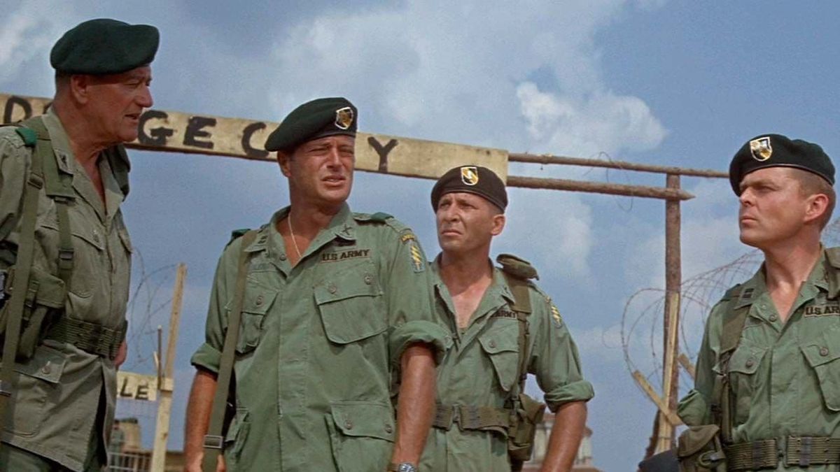 John Wayne and other actors in a scene from the movie Green Berets