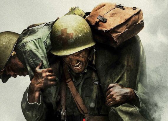 still image of two soldiers one carrying the other in still from the movie Hacksaw Ridge