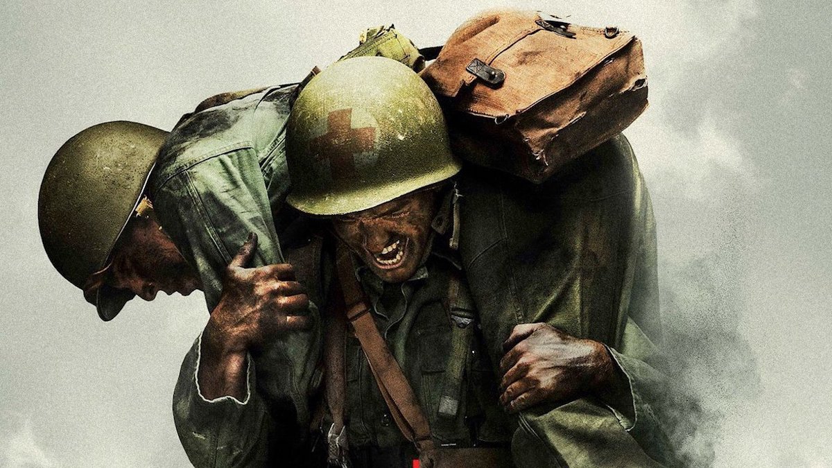 still image of two soldiers one carrying the other in still from the movie Hacksaw Ridge